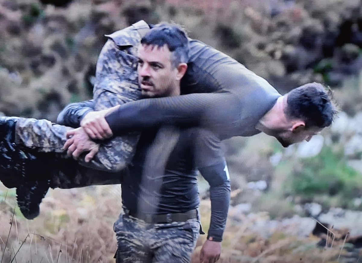 Jamie carrying a fellow recruit on SAS: Who Dares Wins